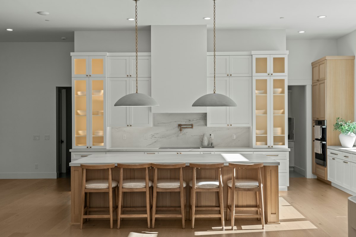 Bright white kitchen with wood island